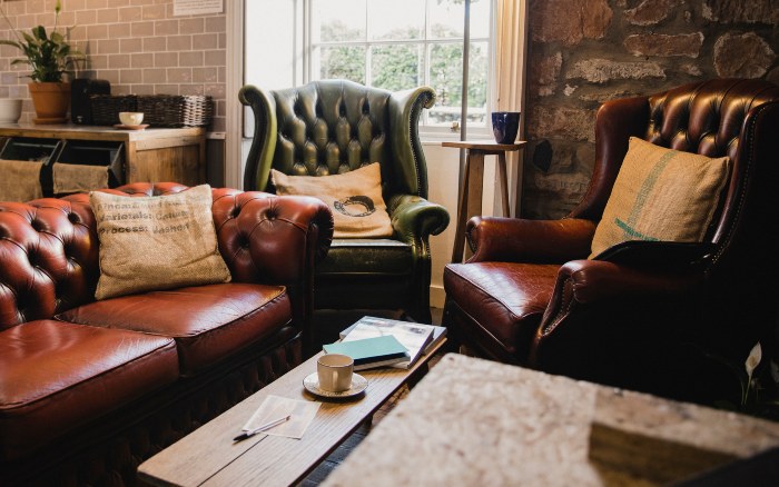 Top grain leather sofa and chair arranged in a warm, inviting setting